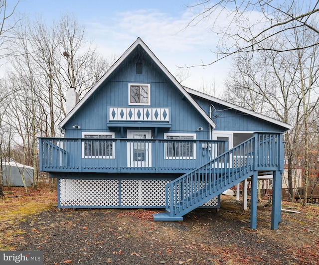 back of house with a wooden deck