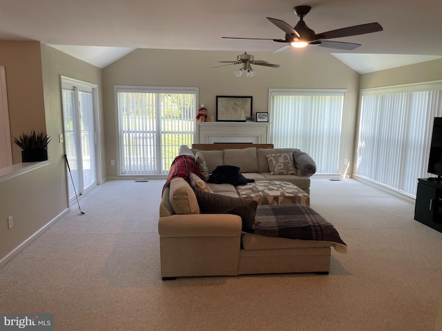 living room featuring vaulted ceiling, ceiling fan, and carpet floors