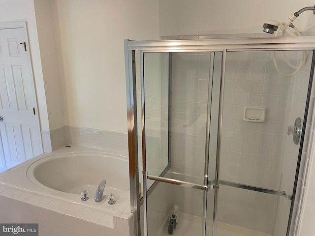 bathroom with tiled bath