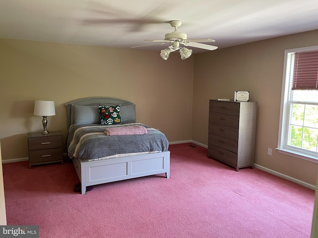 bedroom featuring ceiling fan and carpet