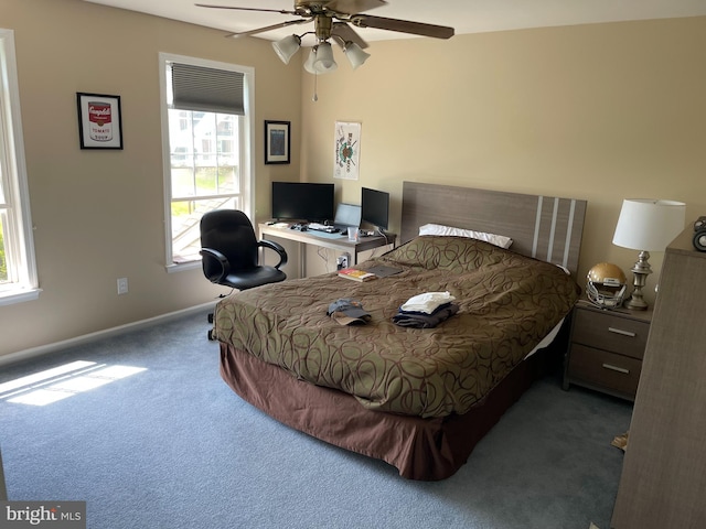 bedroom with carpet floors, ceiling fan, and multiple windows