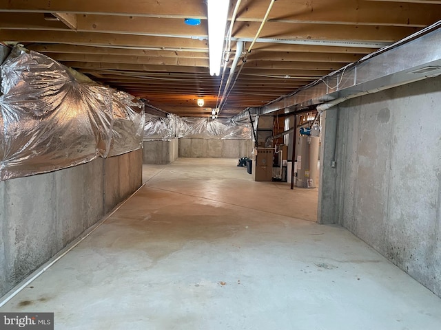 basement featuring heating utilities and gas water heater