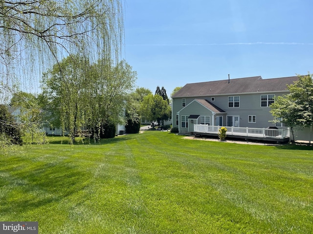 view of yard with a wooden deck