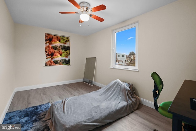 bedroom featuring light wood-type flooring and ceiling fan