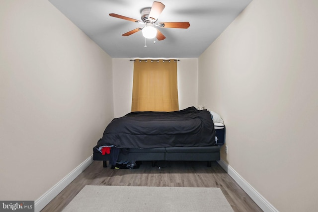 bedroom featuring wood-type flooring and ceiling fan