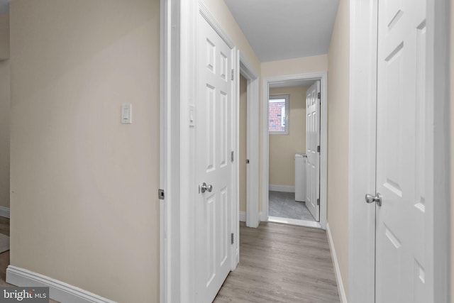 corridor featuring light hardwood / wood-style floors