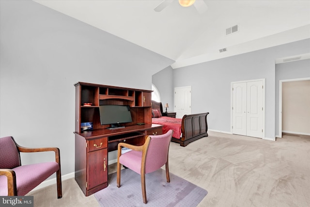 carpeted office space with high vaulted ceiling and ceiling fan