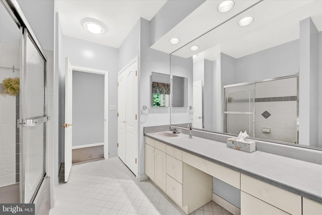 bathroom with tile flooring and large vanity