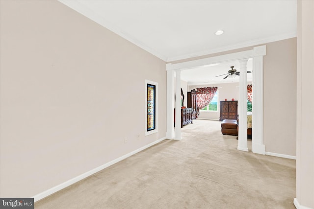 corridor with ornamental molding and light carpet