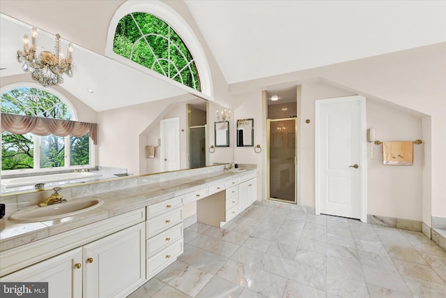 bathroom with plenty of natural light, double vanity, tile floors, and a shower with door