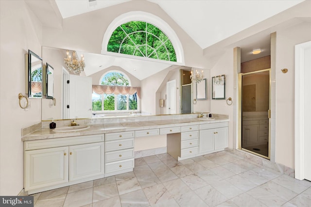 bathroom with a wealth of natural light, double vanity, and tile flooring