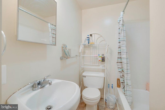 full bathroom with sink, shower / bath combo, tile floors, and toilet