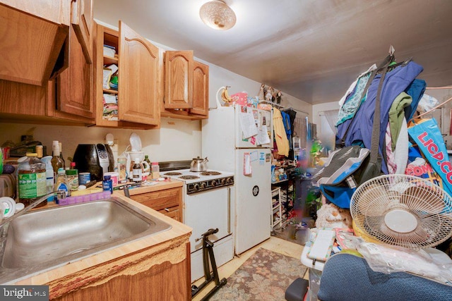 kitchen with sink and white appliances