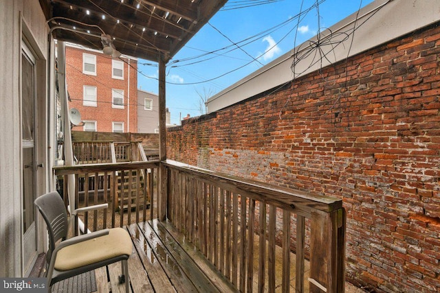 wooden balcony featuring a deck