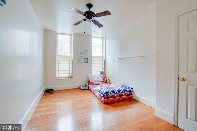 interior space with light hardwood / wood-style floors and ceiling fan