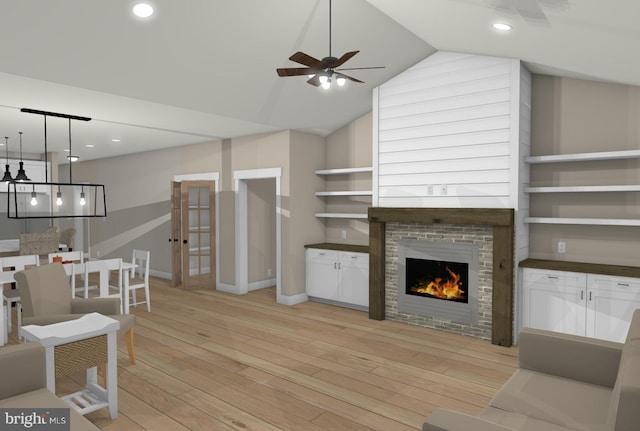 living room with vaulted ceiling, ceiling fan, and light wood-type flooring