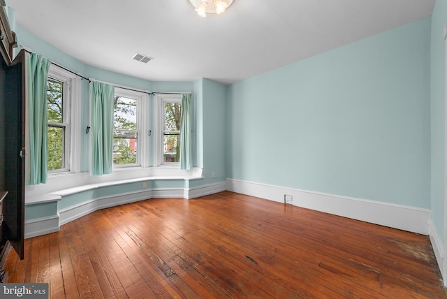 empty room featuring hardwood / wood-style flooring