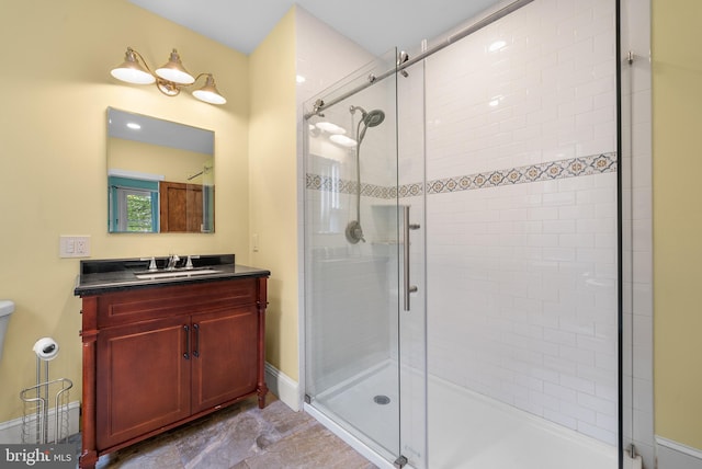 bathroom featuring vanity and walk in shower