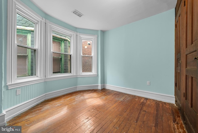 empty room with wood-type flooring