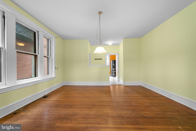 unfurnished dining area with hardwood / wood-style floors