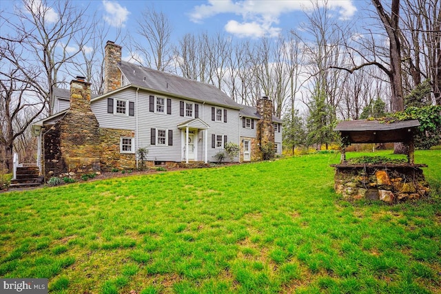 rear view of house with a lawn