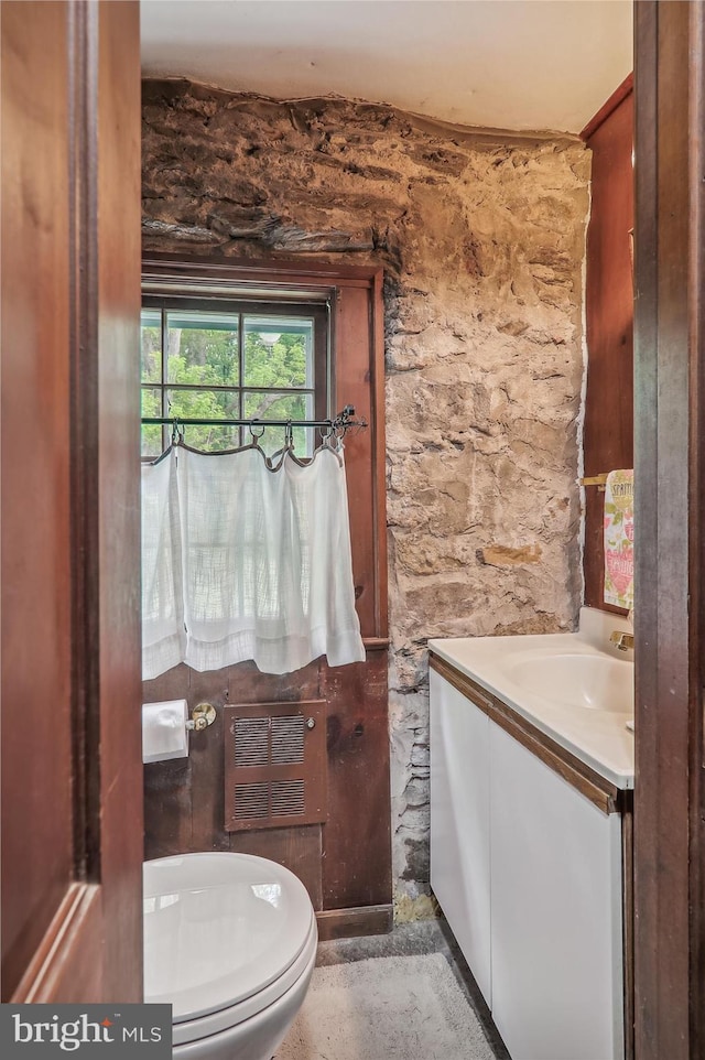 bathroom with vanity and toilet