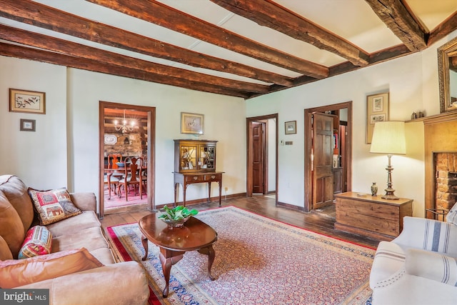 living room with hardwood / wood-style floors and beam ceiling