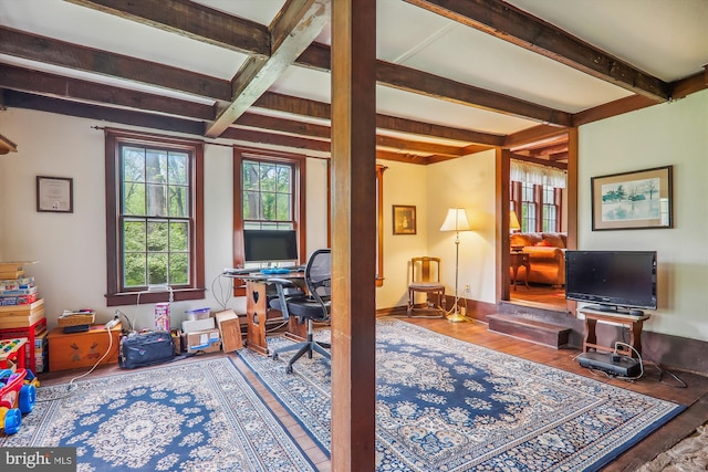 home office with hardwood / wood-style flooring and beamed ceiling