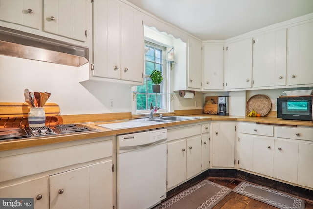 kitchen featuring stainless steel gas cooktop, white cabinets, dark wood-type flooring, white dishwasher, and sink