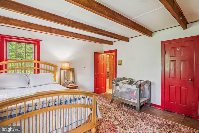 bedroom featuring beamed ceiling