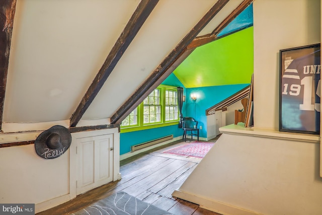 interior space featuring baseboard heating, wood-type flooring, and vaulted ceiling with beams