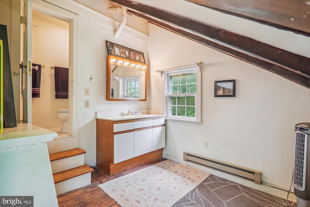 bathroom featuring toilet, tile flooring, vanity, and a baseboard radiator