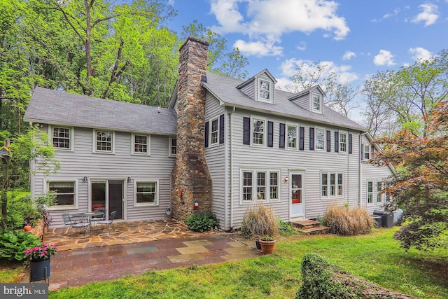 back of property featuring a patio area