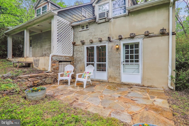 back of property with a patio area