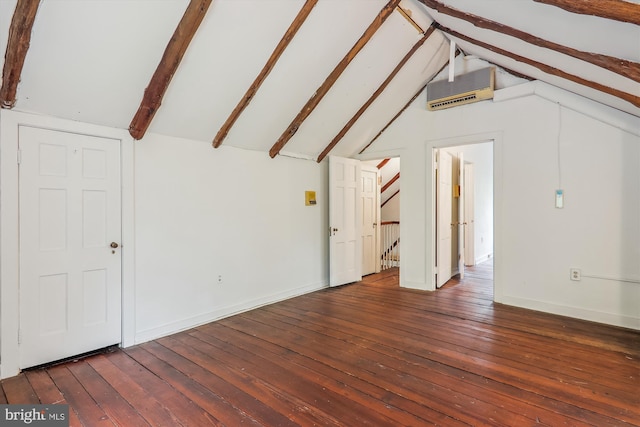 bonus room featuring dark hardwood / wood-style floors, lofted ceiling with beams, and a wall unit AC