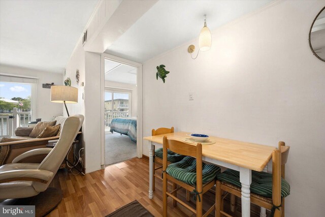 dining space featuring light wood-style flooring and plenty of natural light