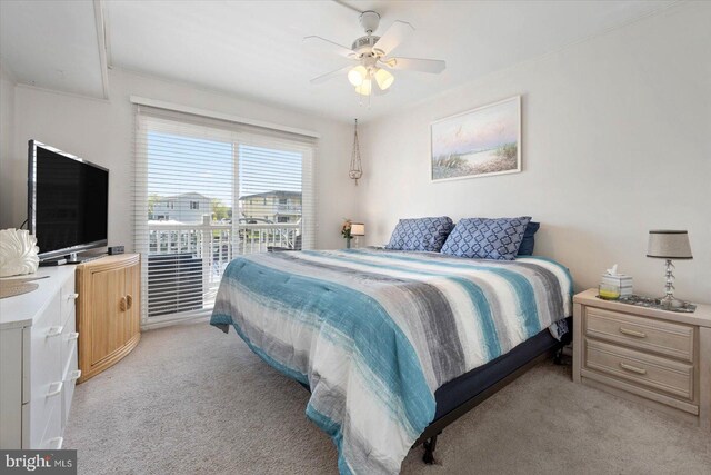 bedroom featuring a ceiling fan and light colored carpet