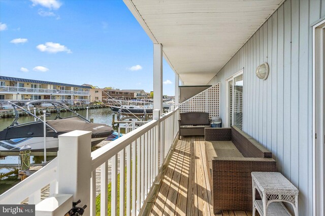 balcony featuring a water view