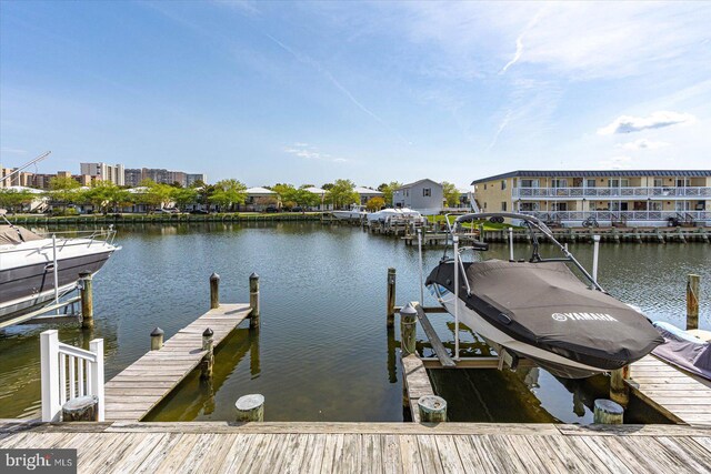 dock area featuring a water view and boat lift