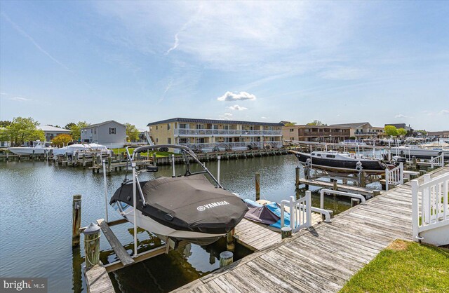 view of dock featuring a water view and boat lift