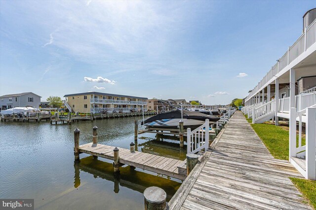 dock area featuring a water view and boat lift