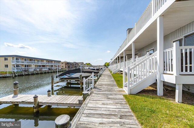 view of dock featuring a water view and boat lift