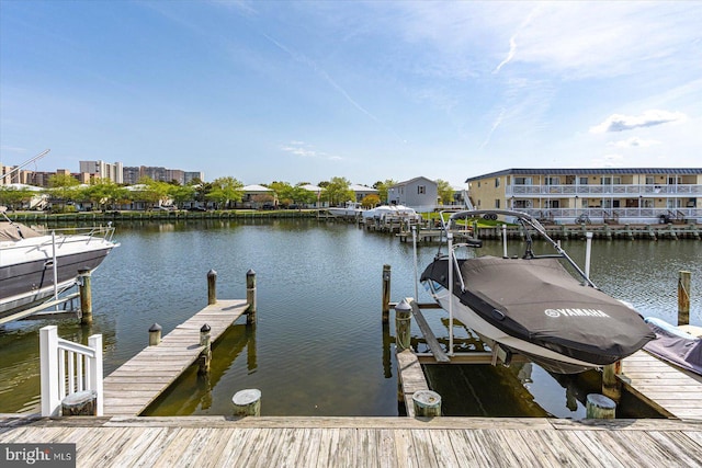 dock area featuring a water view and boat lift