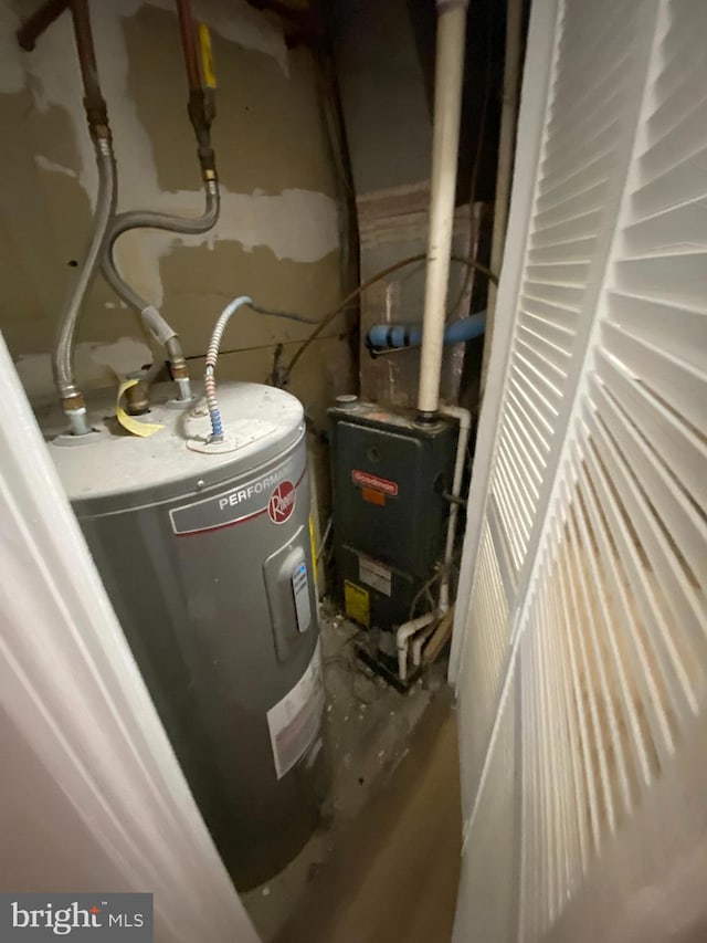 utility room featuring electric water heater