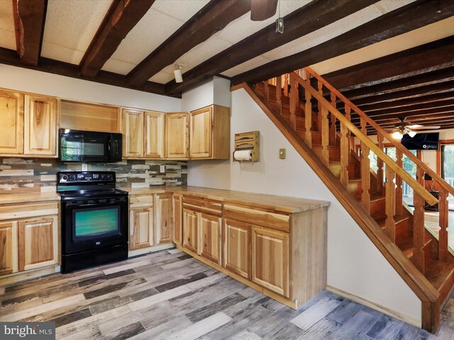 kitchen with light wood-type flooring, backsplash, ceiling fan, black appliances, and beam ceiling