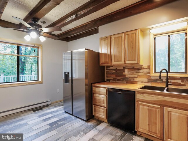 kitchen featuring sink, tasteful backsplash, stainless steel fridge, black dishwasher, and beamed ceiling