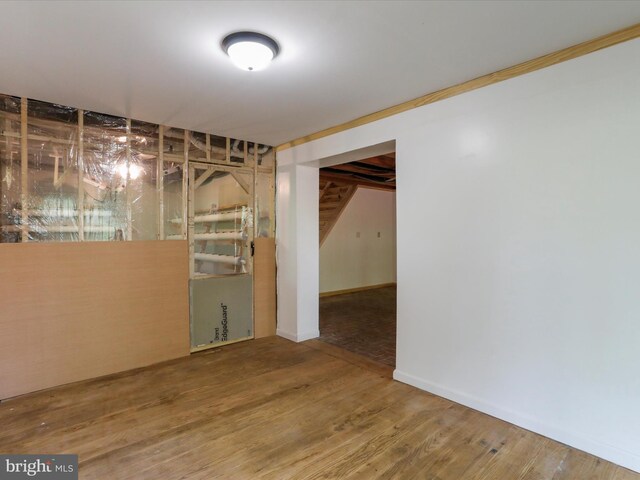 unfurnished room featuring wood-type flooring