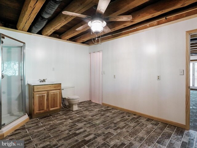 basement with sink, dark wood-type flooring, and ceiling fan