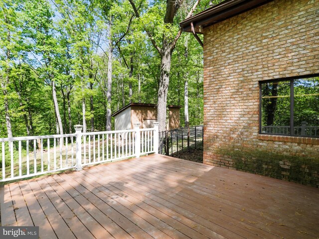 wooden terrace with an outbuilding