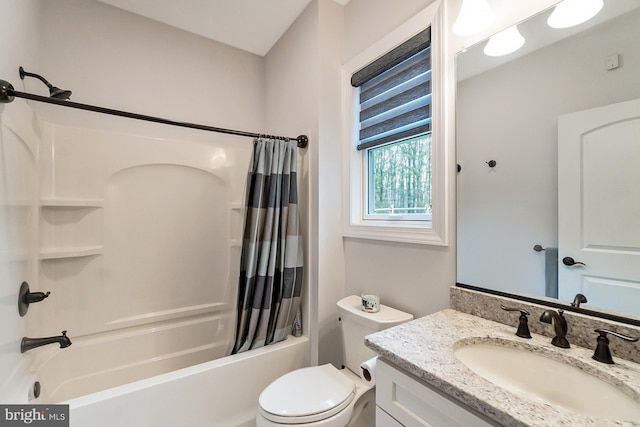 full bathroom with shower / bath combination with curtain, toilet, and vanity